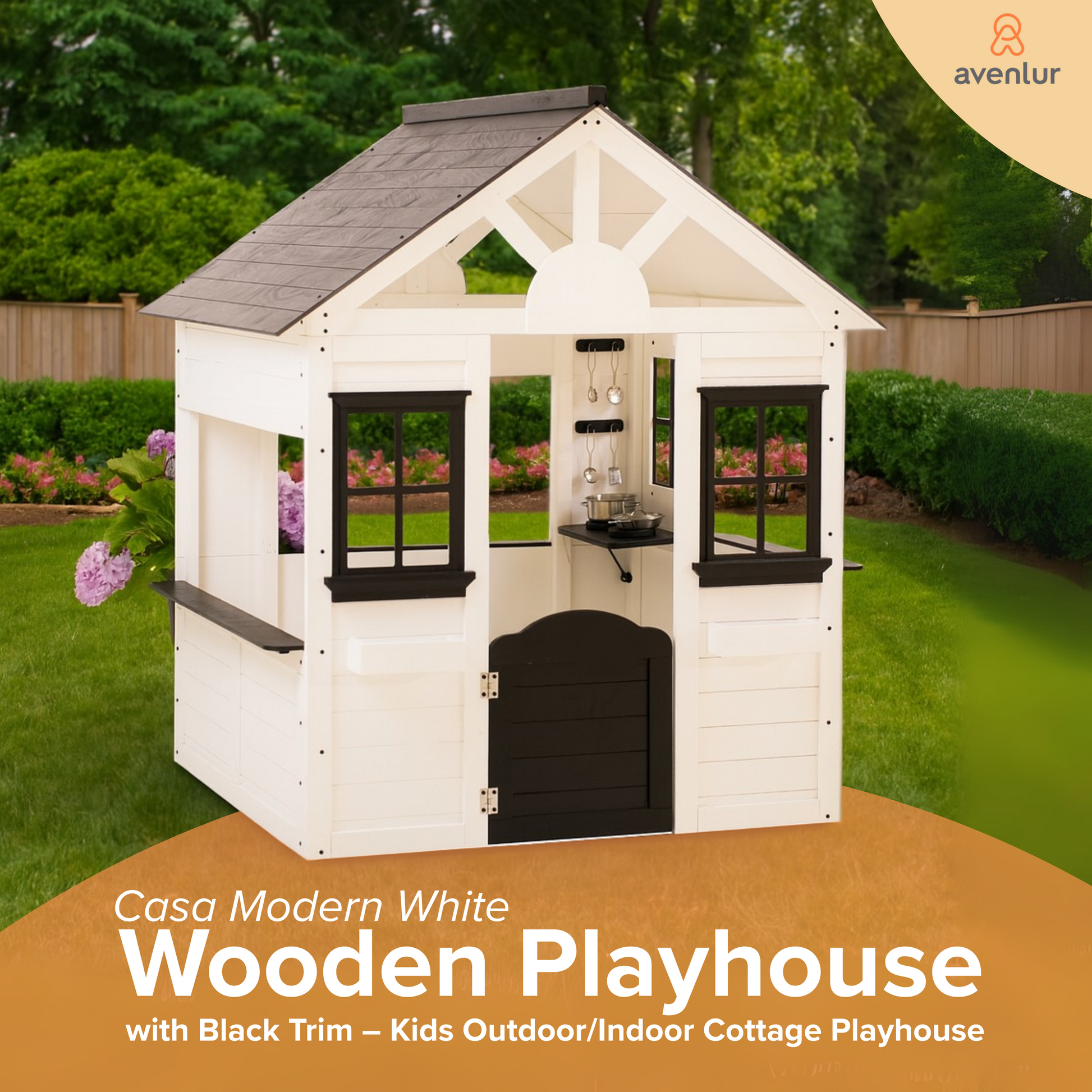 Avenlur Casa Modern White Wooden Playhouse with black trim placed in a lush garden, showcasing its modern cottage design.