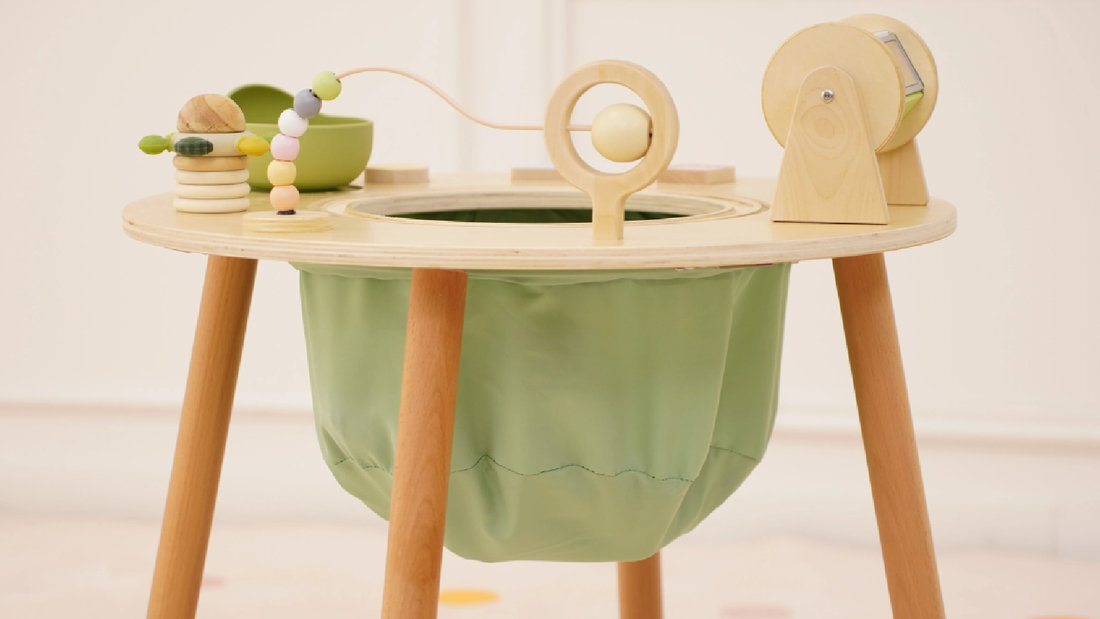 Toddler playing at the Avenlur Aldar Montessori activity table