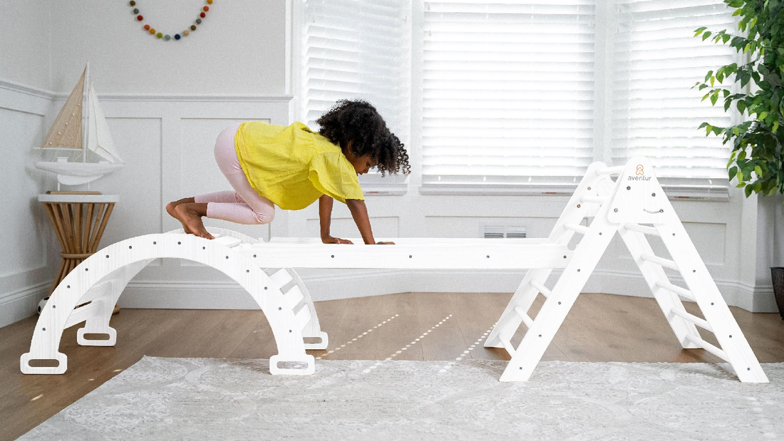 Toddler playing on an Avenlur wooden Pikler triangle set at home, a popular big holiday gift