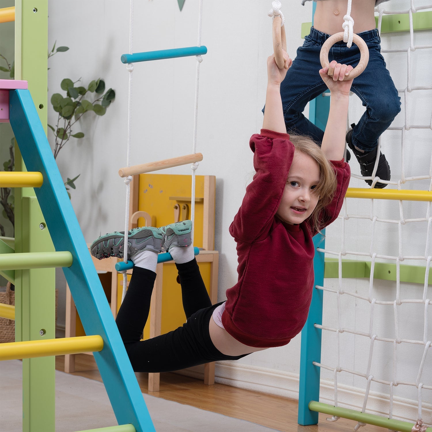 Child on Gymnastic Rings on The Grove Jungle Gym - Avenlur's Premium 8 in 1 Wooden Playset for Older Kids