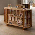 Wooden shelf with decorative items in a room with large windows.