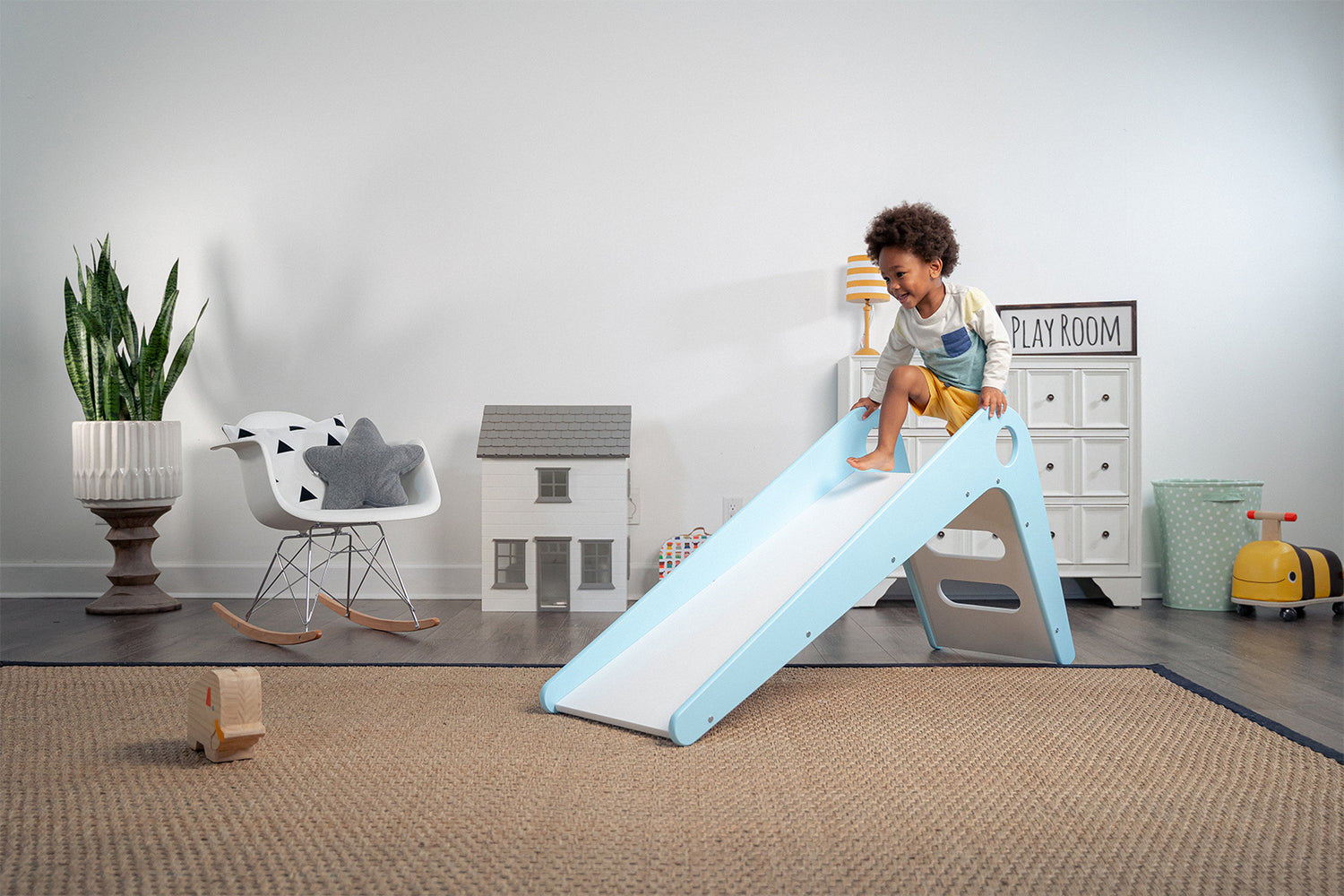 Toddler Climbing Up Manuka - Avenlur's Safe and Fun Indoor Toddler Slide in Playroom.