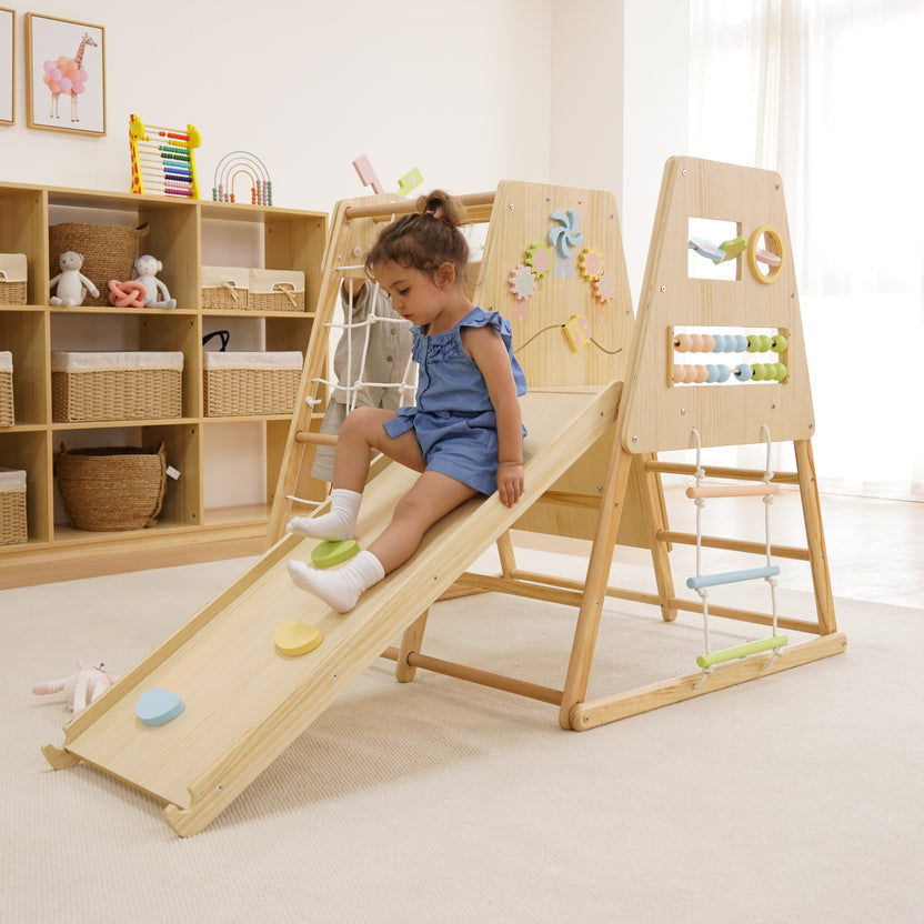 Toddler playing on an Avenlur wooden climbing gym indoors