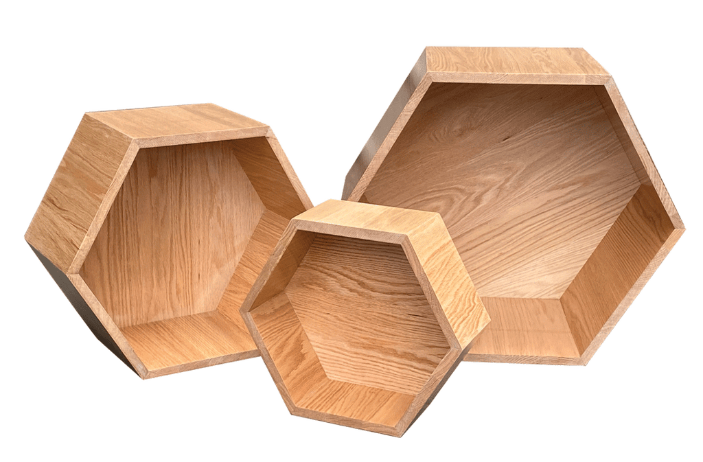 Three wooden hexagonal shelves on a white background