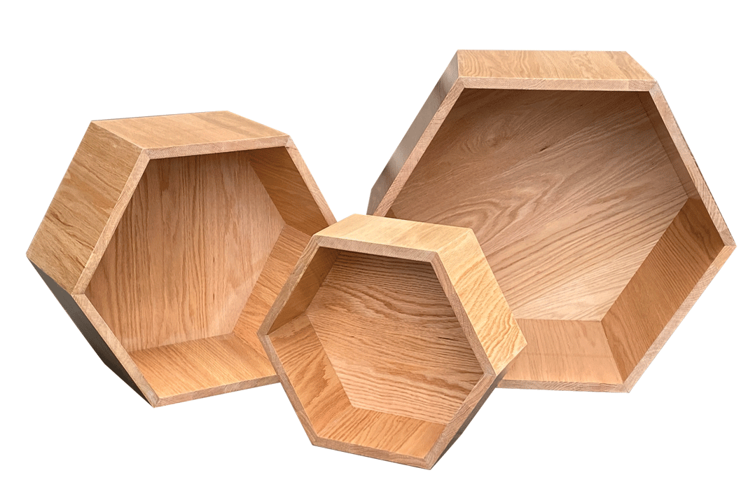 Three wooden hexagonal shelves on a white background