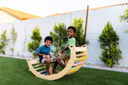 Toddler rocking on the Avenlur Bailis Montessori rocker