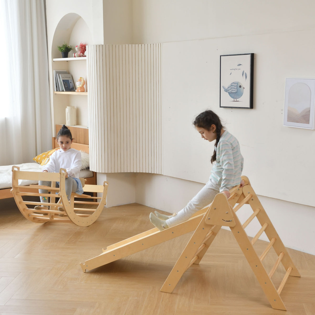 Baby pulling up on the Avenlur Bazel baby climbing gym