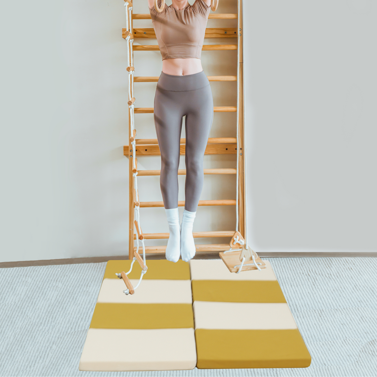 Avenlur Betula cushioned floor mat in front of the wall climber