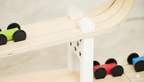 Wooden cars racing down the Avenlur car ramp racer