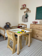 Toddler doing a puzzle at the Avenlur Cordia table