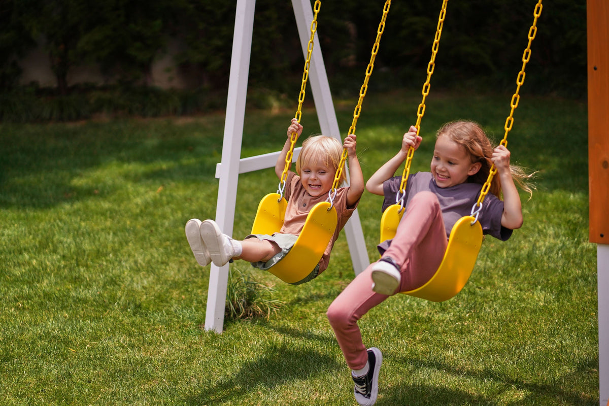 Baby in a bucket swing on the Avenlur Forest Small swing set