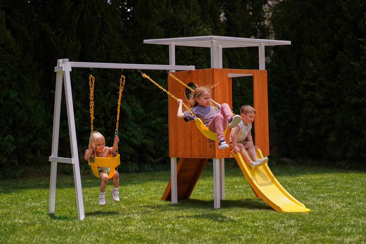 Toddler going down the slide on the Avenlur Forest Small