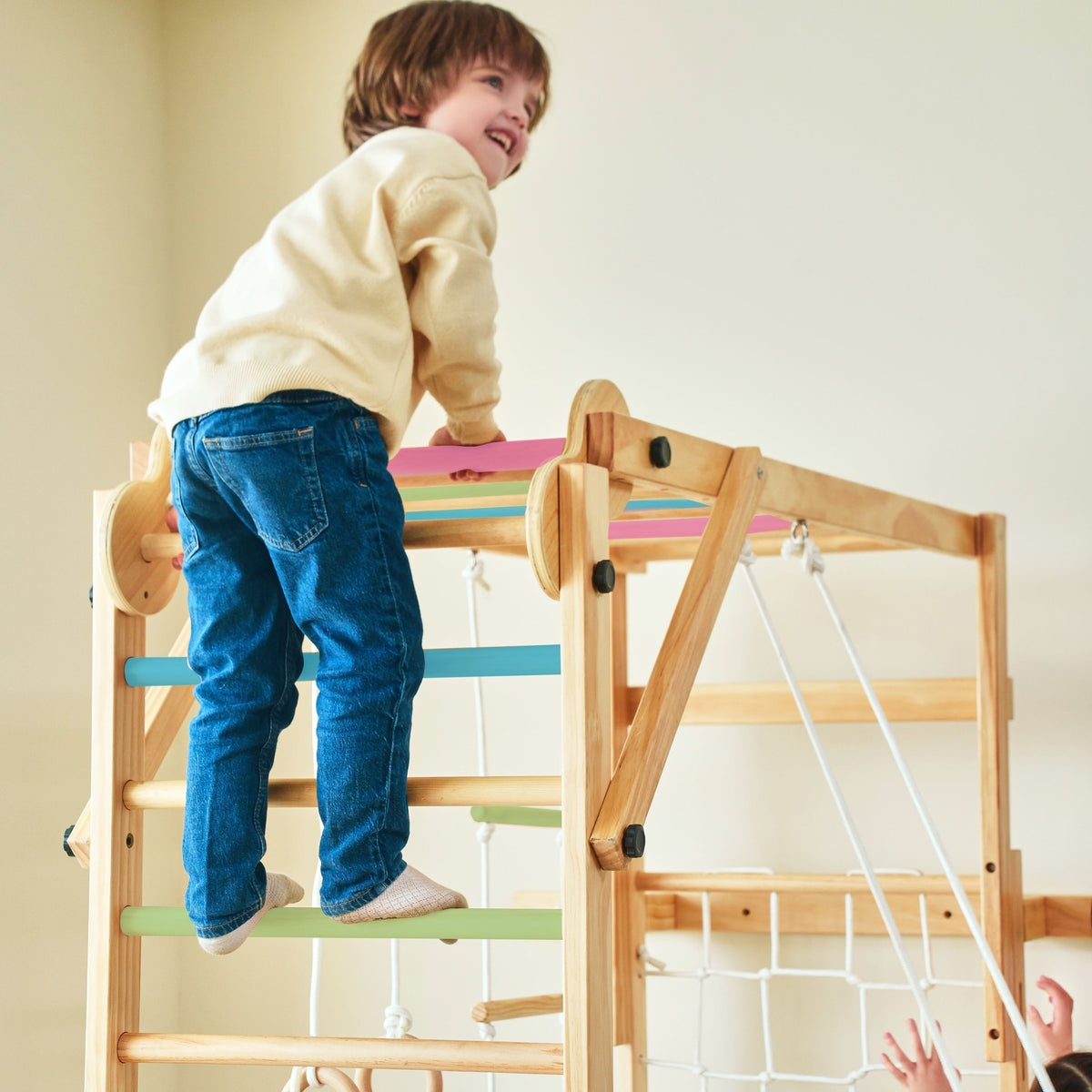Avenlur Grove kids indoor jungle gym folded flat against the wall to save space