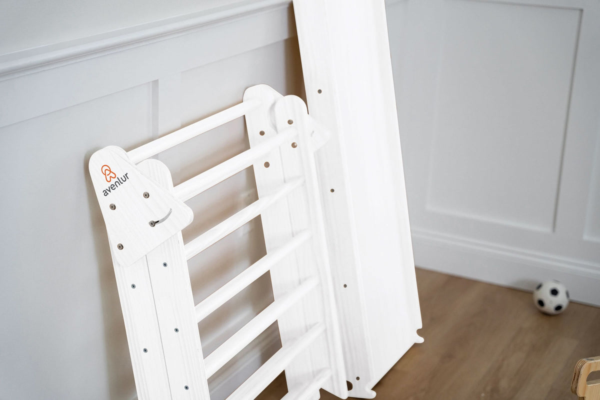 Child climbing the Avenlur Hazel Pikler ladder
