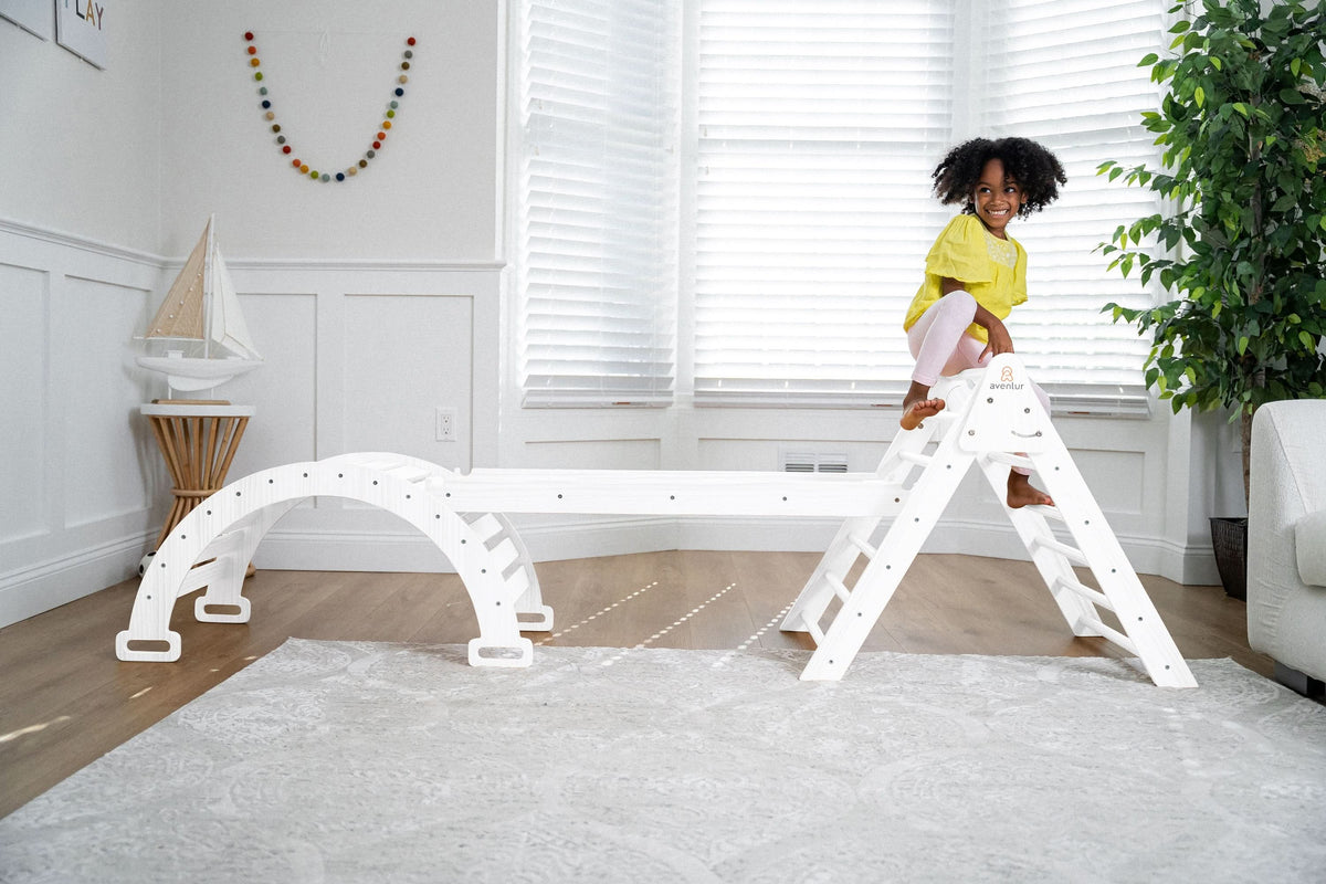 Child crawling through the Avenlur Hazel rocker tunnel