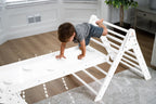 Two kids sharing the Avenlur Hazel wooden rocker