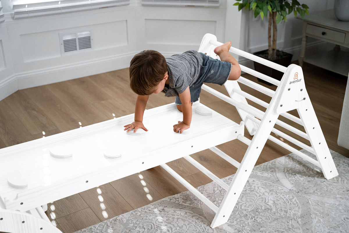 Two kids sharing the Avenlur Hazel wooden rocker