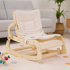 Parent gently rocking a baby in the Avenlur Hemlock rocker