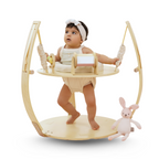Baby standing at the Avenlur Ivy in activity table mode