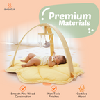 Baby on a play mat under the Avenlur Ivy play gym