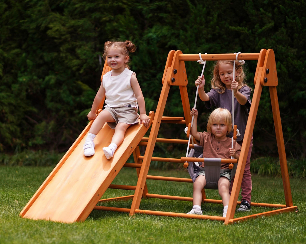 Avenlur Juniper outdoor toddler climber and swing set up in the backyard