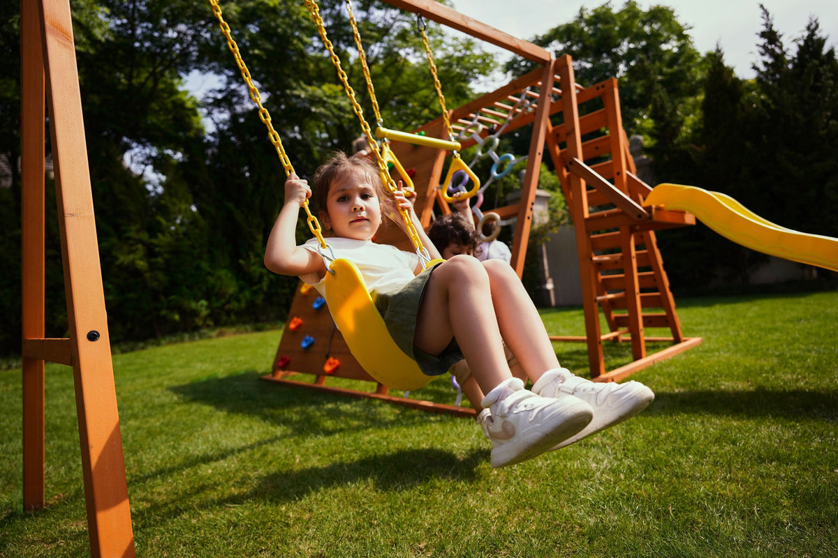 Avenlur Sycamore Jumbo monkey bars for the backyard on a wooden climbing jungle gym