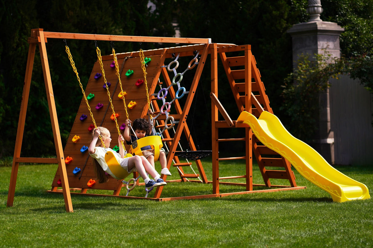 Avenlur Sycamore Jumbo outdoor wooden climbing frame with rock wall and wave slide