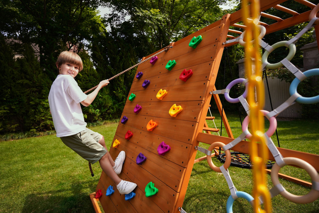 Avenlur Sycamore Jumbo outdoor play set for the backyard with climbing wall and trapeze