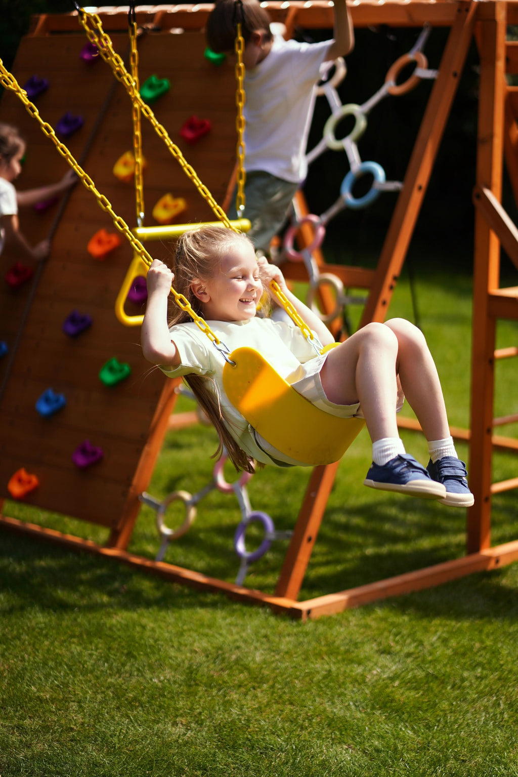Wave slide on the Avenlur Sycamore Jumbo outdoor wooden swing set and jungle gym
