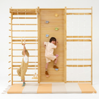 Avenlur Walnut Modular playset mat in front of the Walnut Modular Swedish ladder wall gym