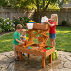 Toddler playing at the Avenlur water table on a summer day