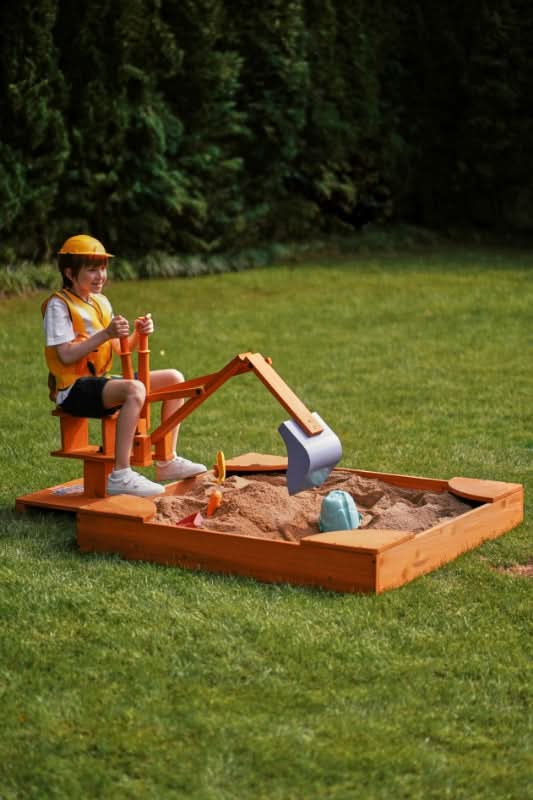 Kid digging dirt with the Blippi excavator
