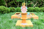Blippi excavator scooping sand in the sandbox