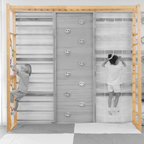 Children climbing on a wooden climbing frame with gray panels.