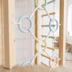 Close-up of the Hawthorn pastel ring and rope climbing wall with wooden rungs
