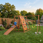 Boy climbing up the wooden ramp of the Sycamore XL outdoor play set