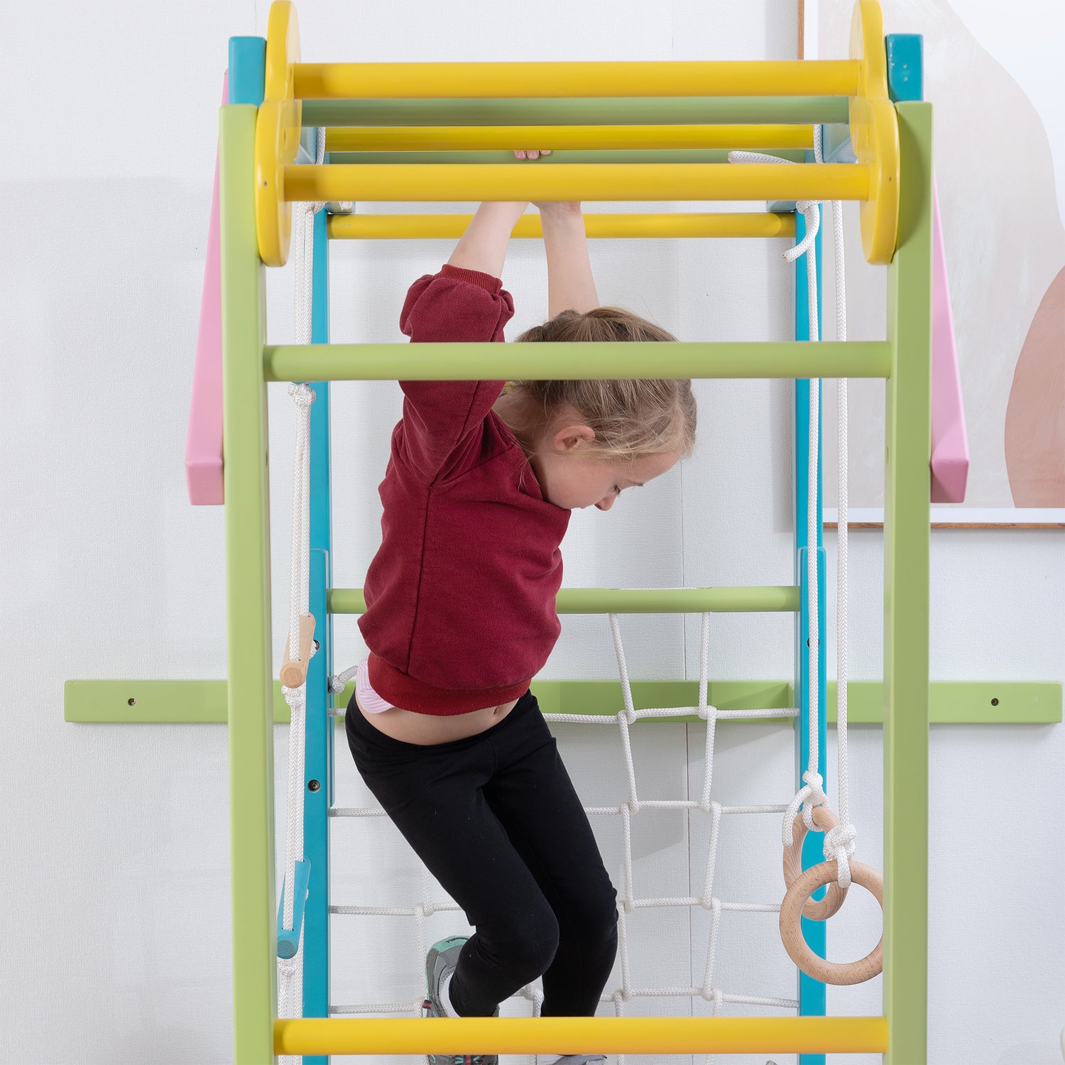 Girl Climbing Bars on The Grove Jungle Gym - Avenlur's Premium 8 in 1 Wooden Playset for Older Kids - Colorful Edition