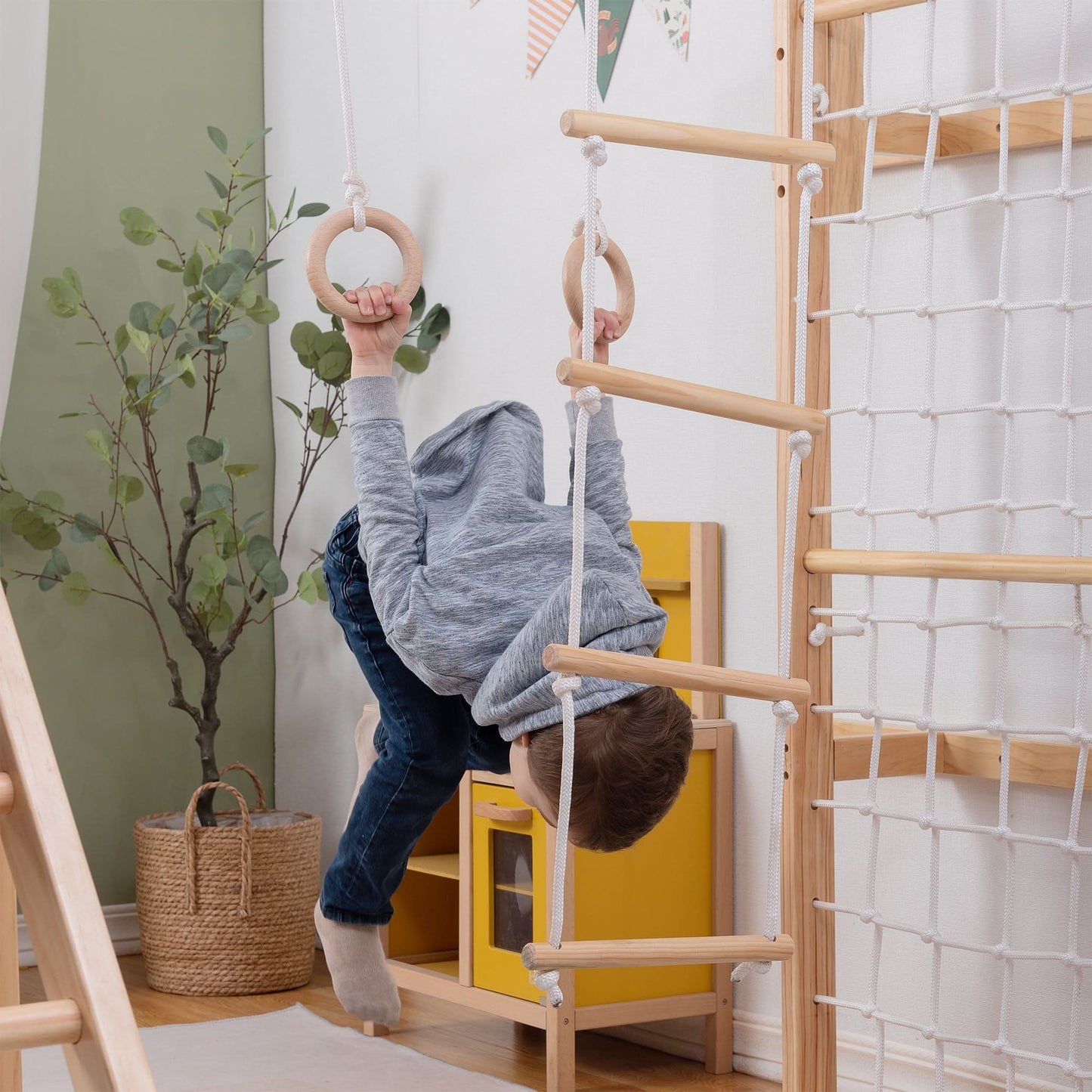 Child Playing on Gymnastic Rings on The Grove Jungle Gym - Avenlur's Premium 8 in 1 Wooden Playset for Older Kids