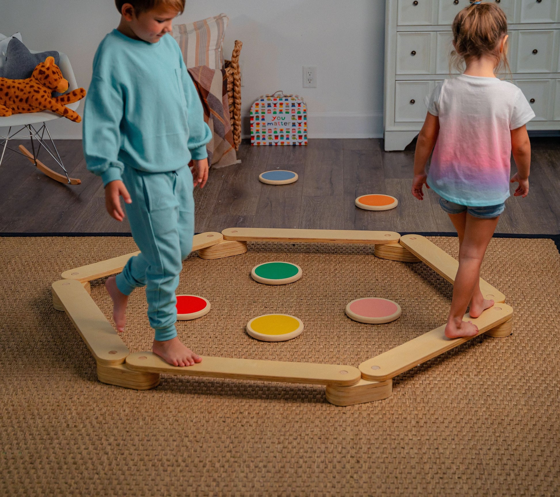 Children Balancing on Avenlur's Majesty Balance Beam with Stepping Stones