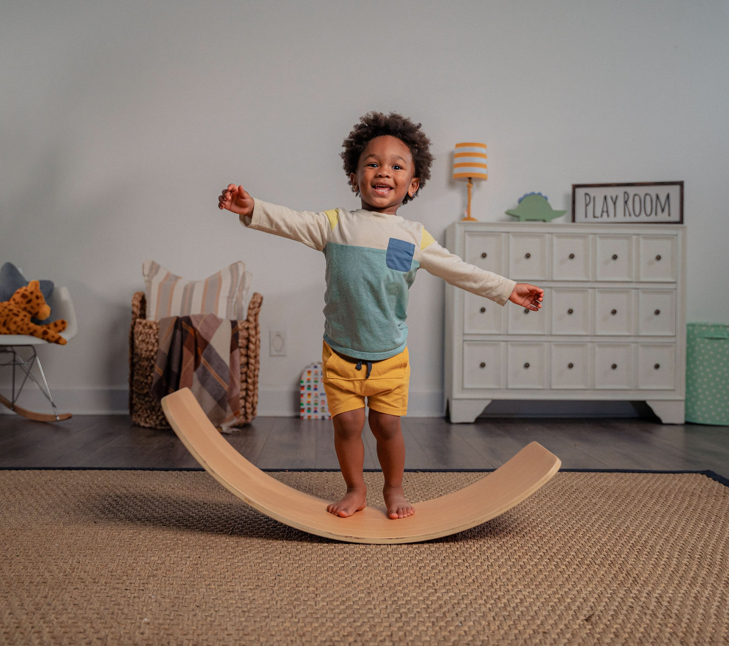 Toddler Standing on Redbud - Avenlur's Curvy Rocker Wobble Balance Board for Yoga & Exercise