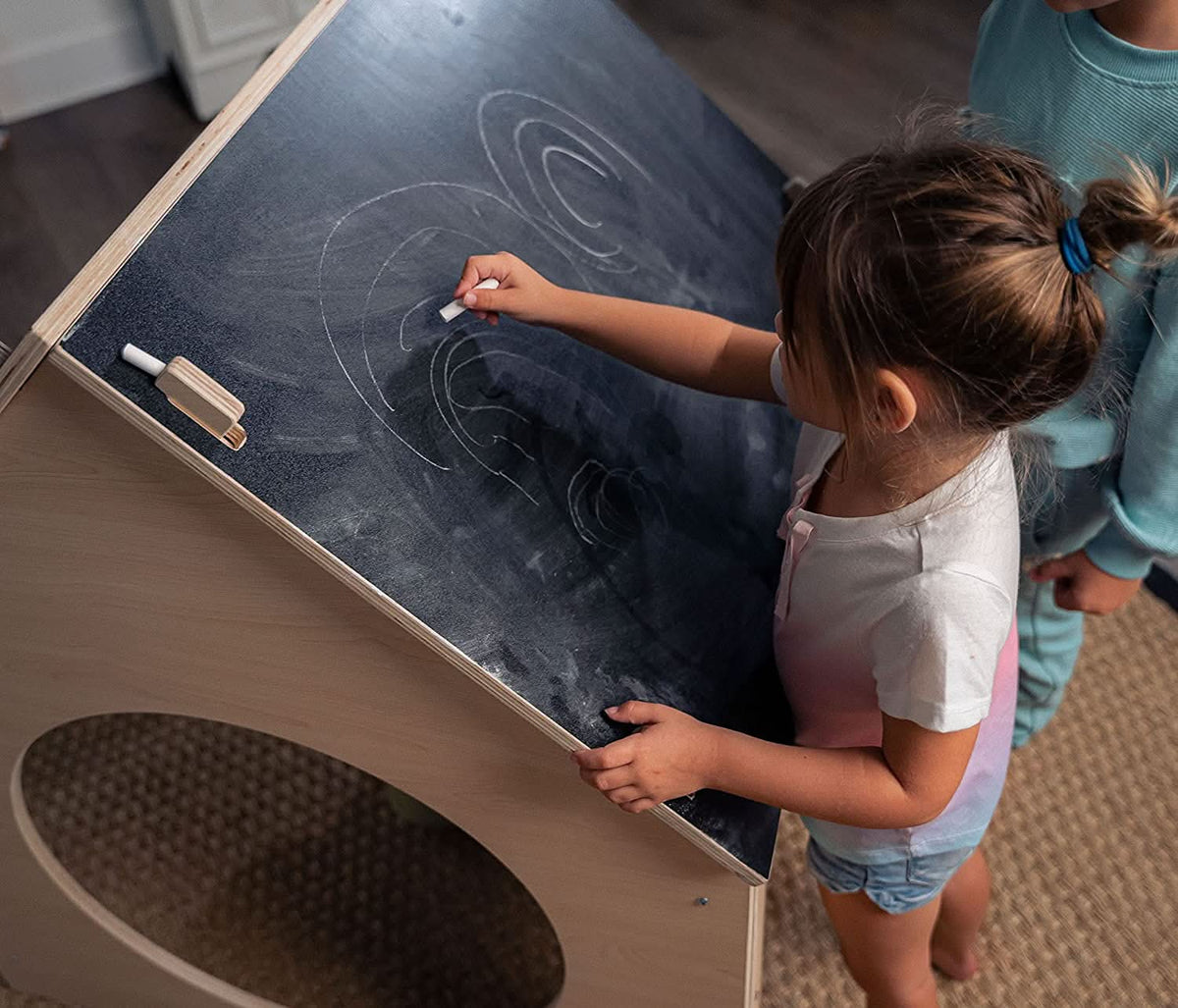 Child drawing on the Avenlur Evergreen chalkboard roof