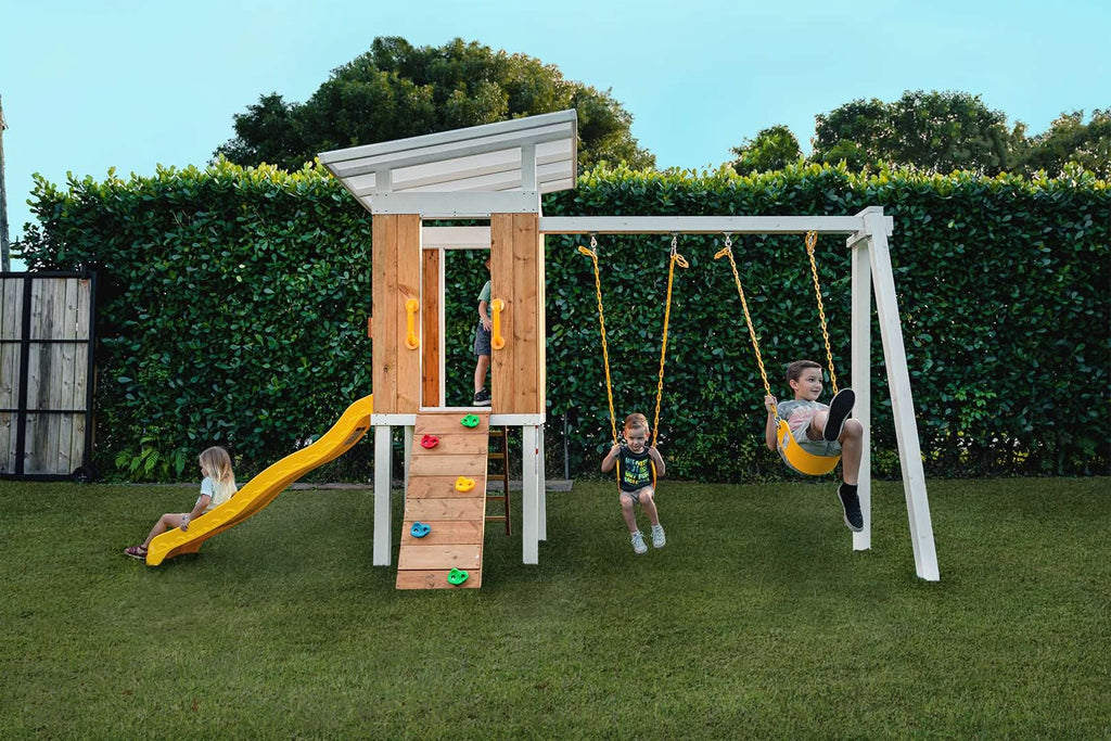 Full view of the Avenlur Forest modern swing set and playhouse