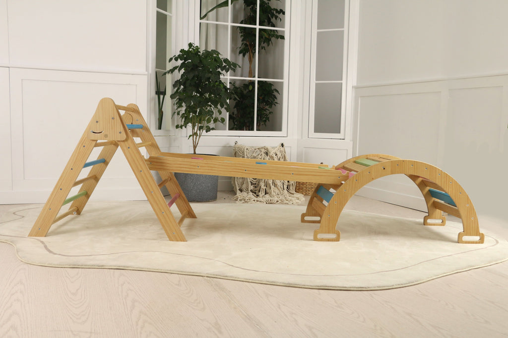 Toddler sliding down the Avenlur Hazel climbing ramp