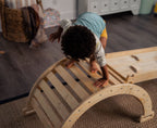Toddler climbing up the Avenlur Hazel Pikler ramp