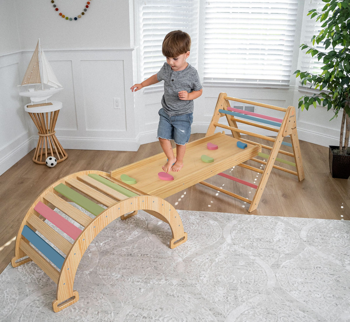 Avenlur Hazel Pikler slide attached to the triangle in a playroom