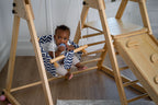 Avenlur Juniper folding toddler climber set up in a bright room