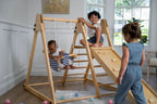 Toddler on the Avenlur Juniper toddler swing indoors