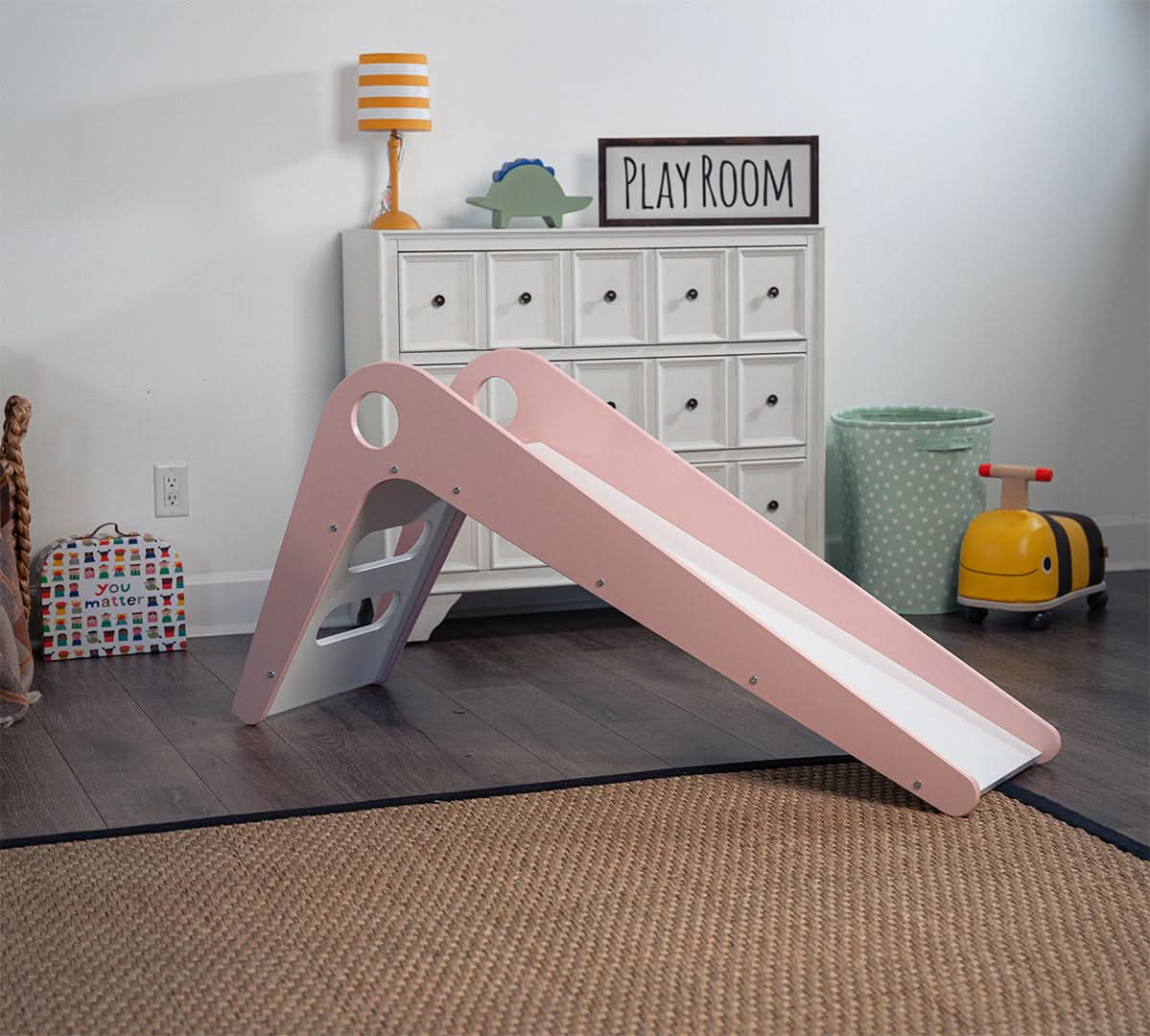 Avenlur Manuka indoor toddler slide next to the nursery play area