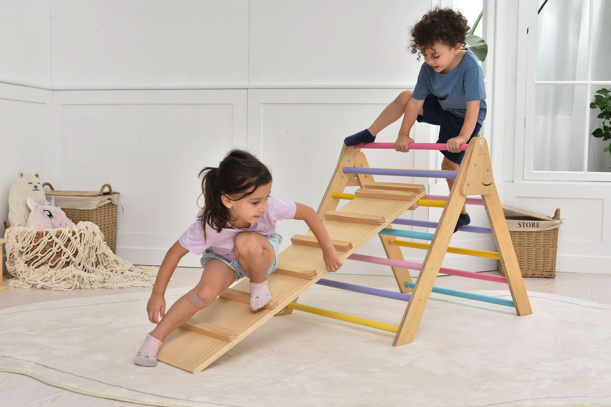 Toddler climbing the Avenlur Olive Pikler triangle ladder at home