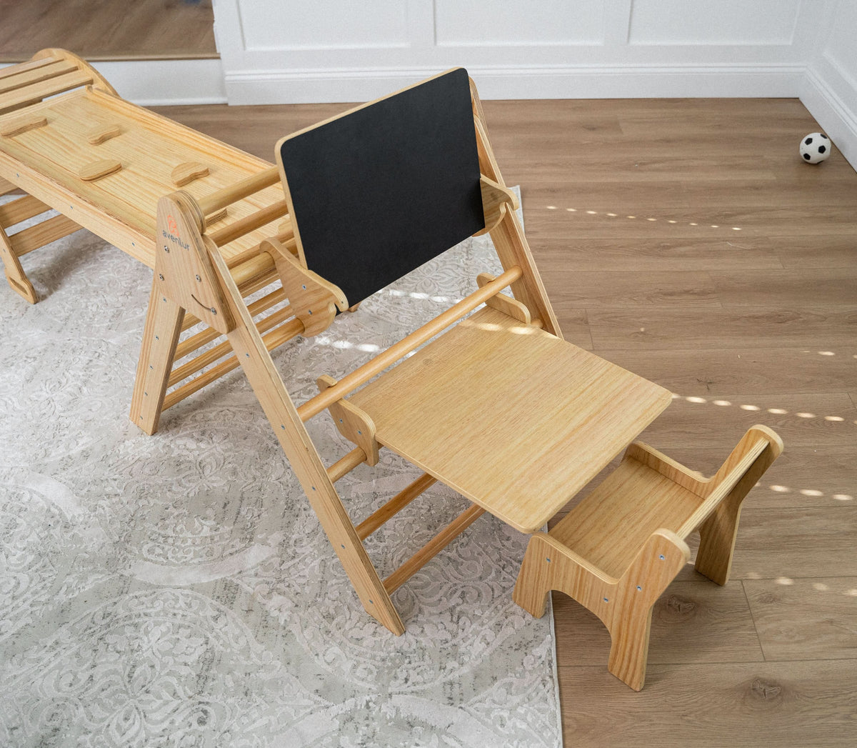Pikler triangle converted into a toddler desk with the Avenlur attachment